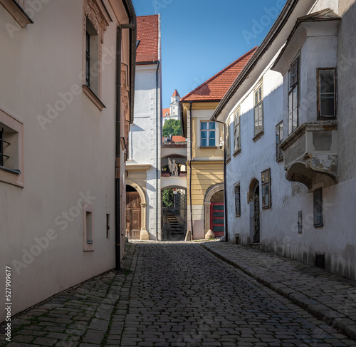 Photography Old Town alley street with Bratislava Castle on background - Bratislava, Slovaki