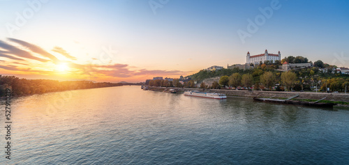 Panoramic skyline view of Danube river and Bratislava Castle at sunset - Bratislava, Slovakia