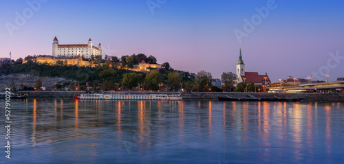 Panoramic skyline view of Bratislava Castle and St. Martin Cathedral at sunset - Bratislava, Slovakia
