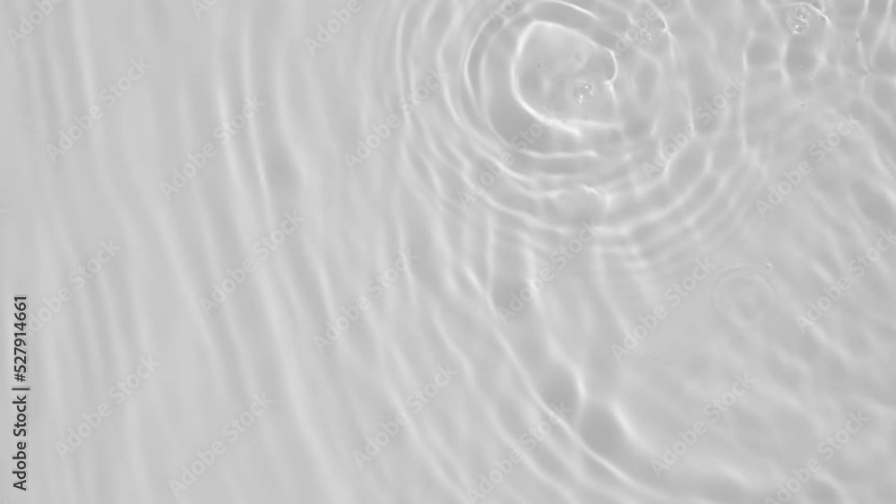 Transparent clear calm water surface texture with waves, splashes and bubbles. Trendy abstract nature background. White grey water waves in sunlight. Slow motion Full HD video banner. Transparent clear calm water surface texture with waves, splashes and bubbles. Trendy abstract nature background. White grey water waves in sunlight. Slow motion Full HD video banner.