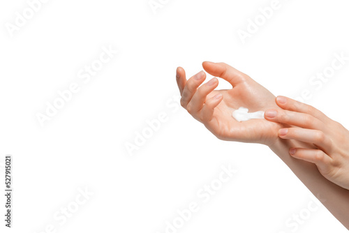 Cropped shot of woman applying organic cream on hand. Young woman applying hand cream. photo