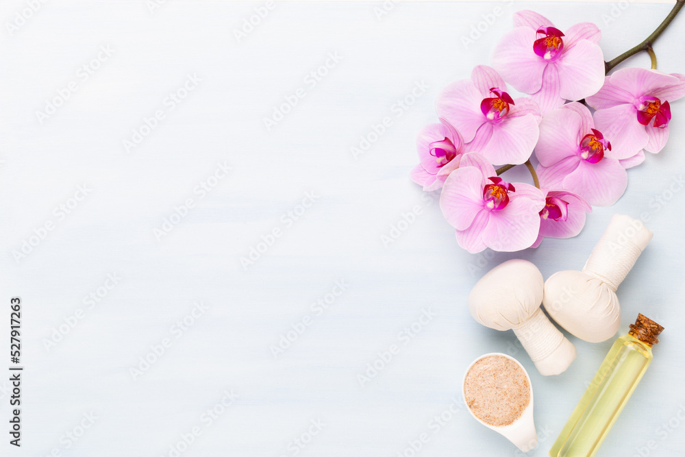 Sea salt, aromatherapy oil in bottles and orchid on vintage wooden background. Sea salt, aromatherapy oil in bottles and orchid on vintage wooden background.