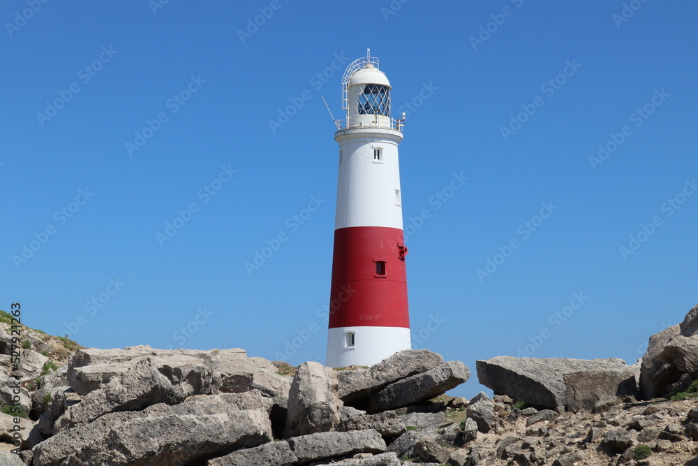 The distinctive red and white striped lighthouse at Portland Bill in Dorset, England