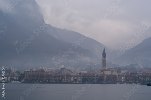 town in the fog on como lake