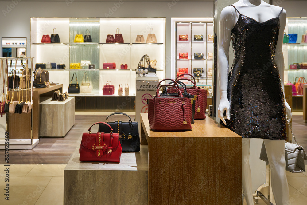 SINGAPORE - CIRCA JANUARY, 2020: bags on display at Michael store in Singapore Changi Airport. Stock Photo | Adobe Stock