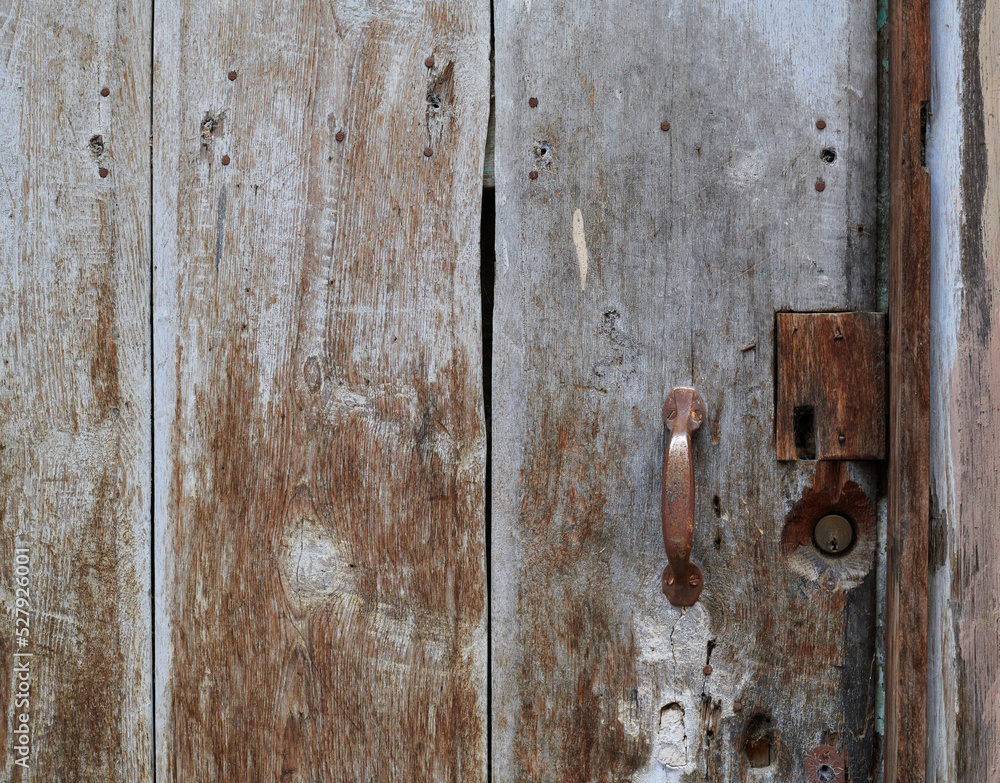 Old, picturesque main front door in mediterranean region house. Old, picturesque main front door in mediterranean region house.