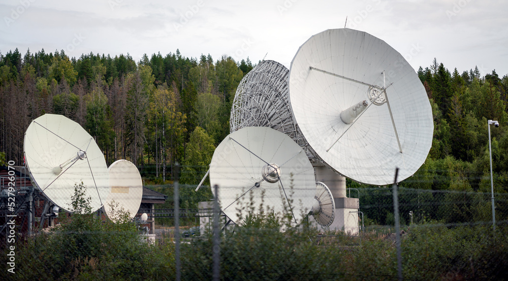 Satelitte area with huge satelitte dishes. 5g, tech and worldwide communication concept.