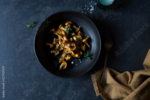 Bowl of chanterelle mushrooms on table