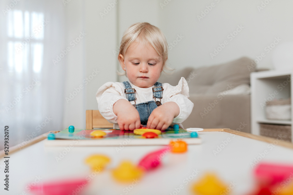 Cute girl playing board game at home Cute girl playing board game at home