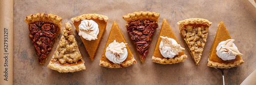 Variety of fall pie slices on parchment paper