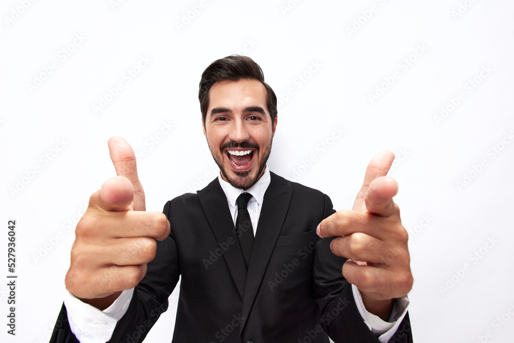 Portrait of a man in an expensive business suit close-up wide-angle lens pulls his hands into the camera with open mouth surprise happiness and shows thumbs up on white background, copy space Portrait of a man in an expensive business suit close-up wide-angle lens pulls his hands into the camera with open mouth surprise happiness and shows thumbs up on white background, copy space