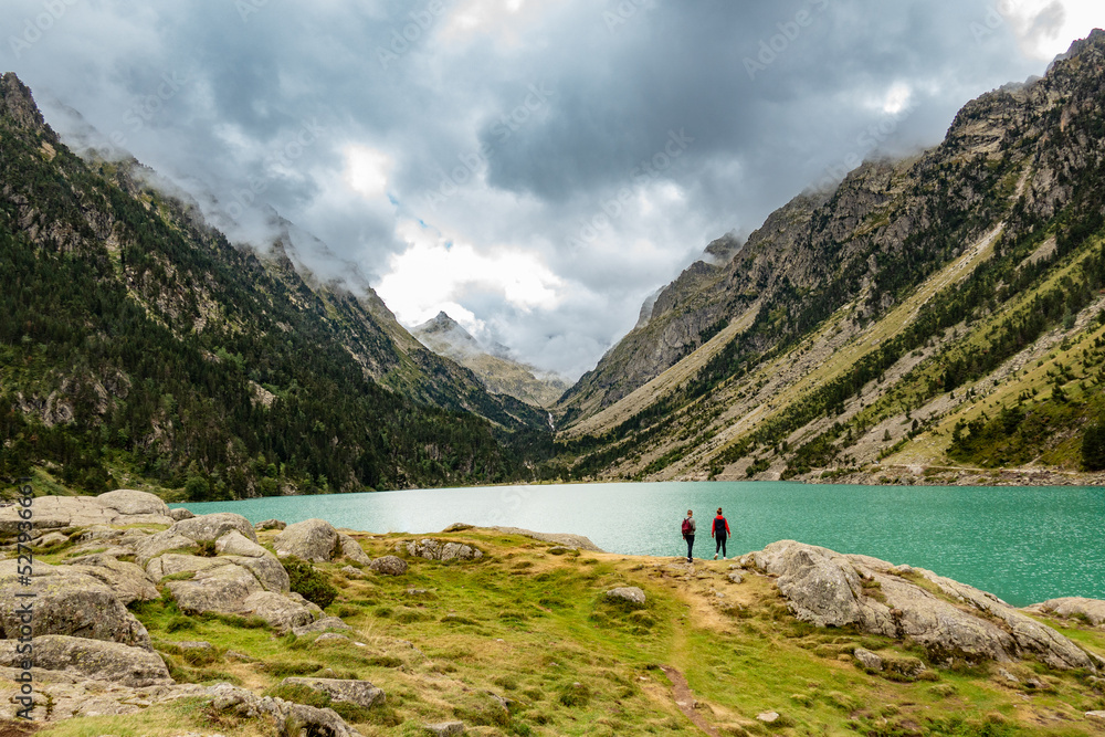 hiker in the mountains and lake hiker in the mountains and lake