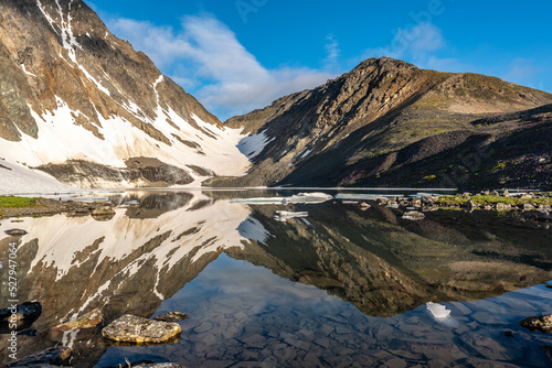 Incredible alpine lake in Yukon Territory, near Alaska & Canada. Snow capped mountains and glacier. 