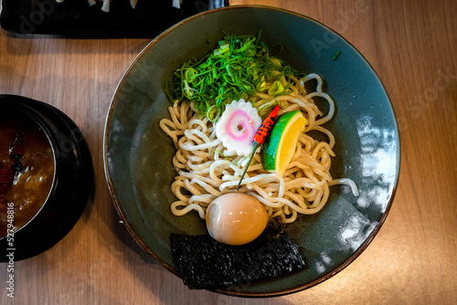 Delicious tsukemen ramen served with hot pork base dip sause photo