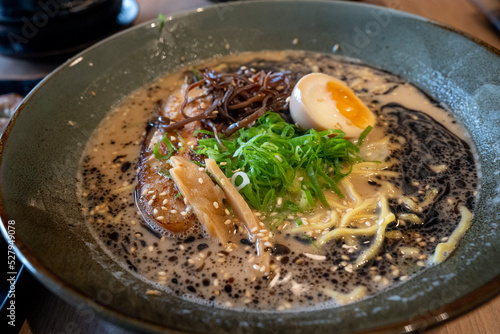 Mouth watering japanese ramen in a bowl served with egg