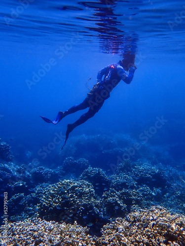 Indonesia Anambas Islands - Men snorkeling in coral reef