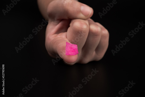 Εκτύπωση καμβά pink lsd stamp mark on fingertip, recreational drugs lysergic acid intake