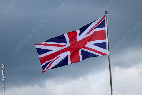 The British flag flying on a cloudy day