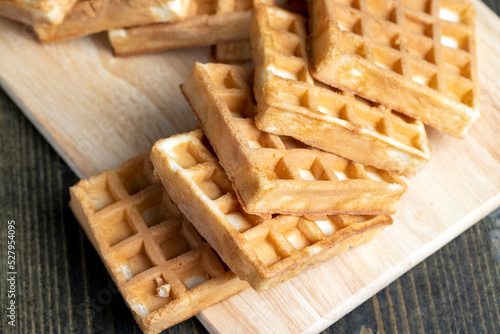 square sweet soft waffles on the table photo