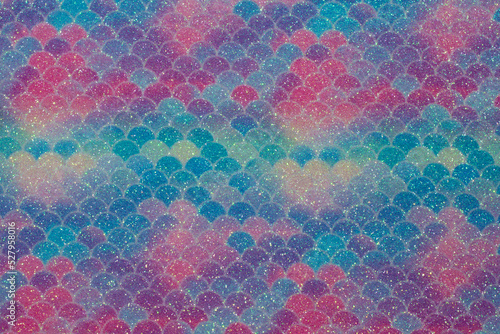 Beautiful shiny multi-colored background of sequins and bokeh