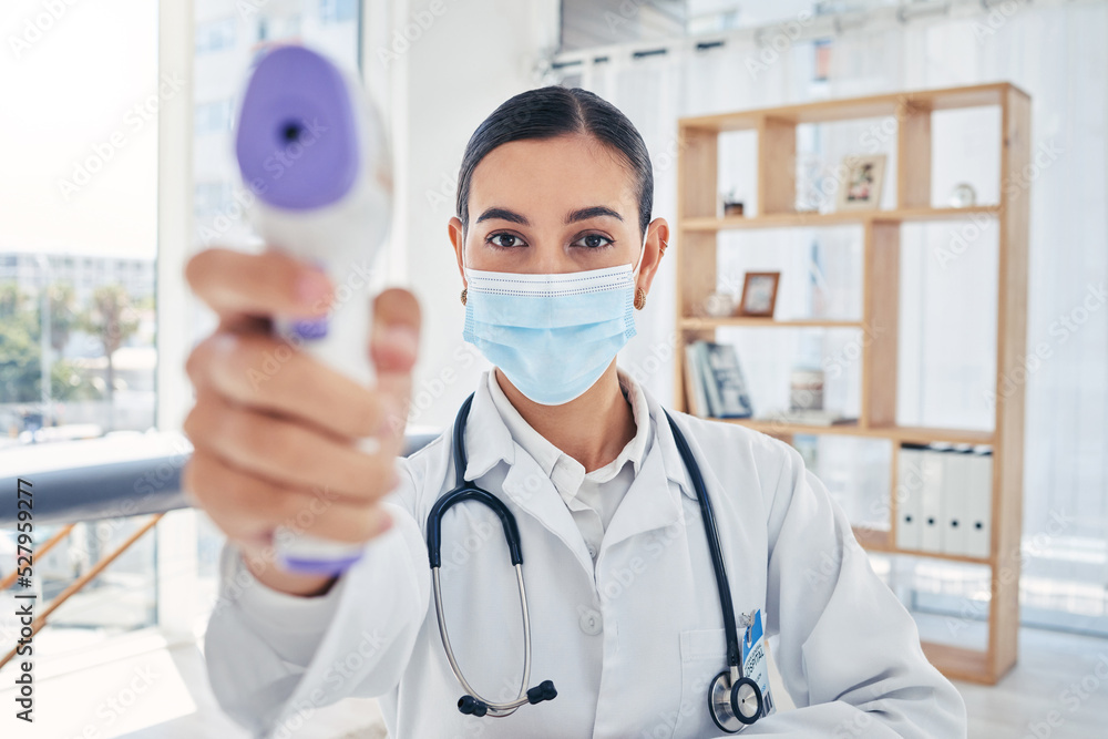 Covid doctor thermometer, safety check and corona virus risk in hospital, clinic and medical surgery. Portrait of healthcare worker consulting with face mask, wellness service test and fever laser Covid doctor thermometer, safety check and corona virus risk in hospital, clinic and medical surgery. Portrait of healthcare worker consulting with face mask, wellness service test and fever laser