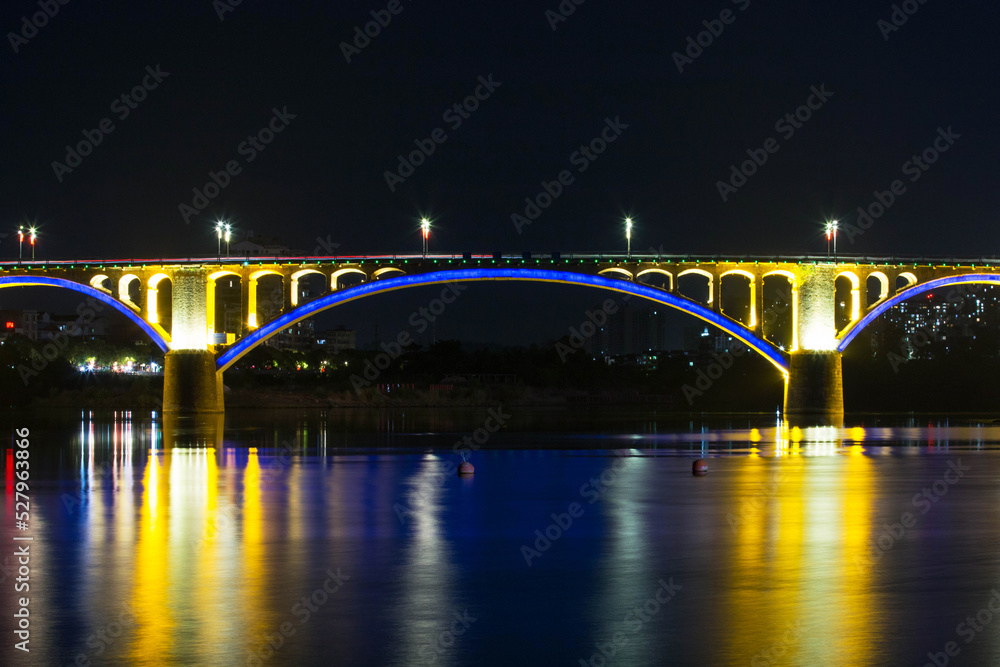 brige over river at night