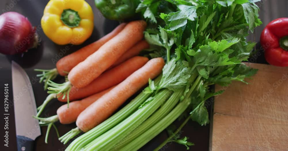 Shot of the vegetables and cutting board on the table Shot of the vegetables and cutting board on the table