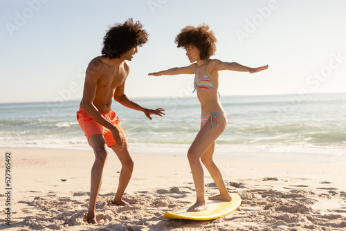 Young couple surfing on a beach