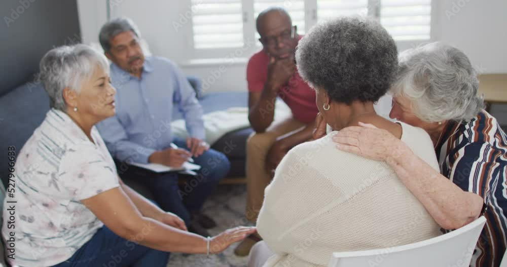 Diverse group of senior friends giving support to each other on meeting Diverse group of senior friends giving support to each other on meeting