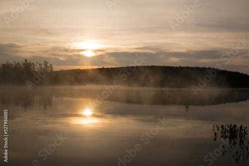 Calm lake with mist rising