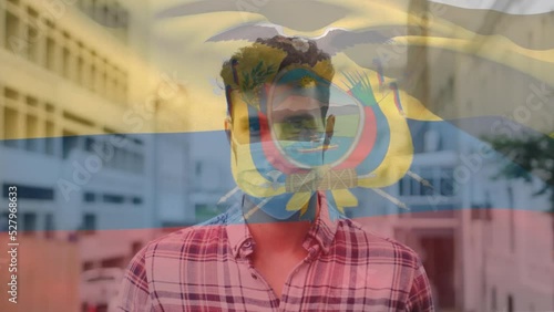 Animation of flag of equador waving over latin man wearing face mask in city street photo
