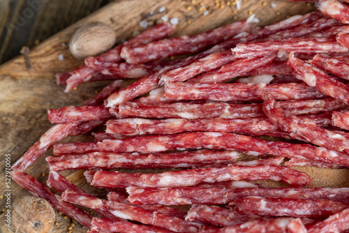 Wallpaper Mural thin dried meat sausages with spices , close up Torontodigital.ca