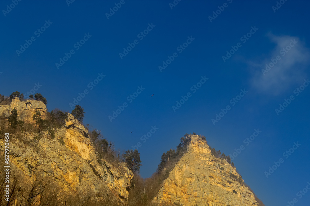 Triangular mountain shape of Mezmay's Eagle nest, Caucasus mountains, blue sky with copy space for text