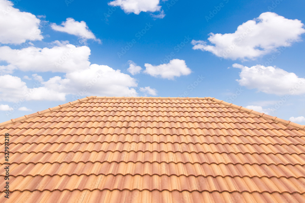 Roof tiles and sky sunlight. Roofing Contractors concept Installing House roof. Roof tiles and sky sunlight. Roofing Contractors concept Installing House roof.