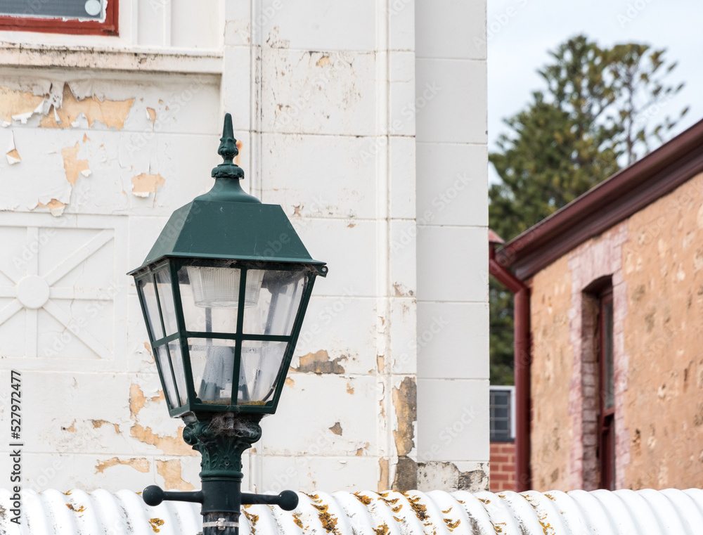 Vintage street lamp in front of an old building