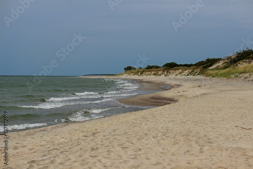 Seashore  sand dunes soft sunlight  clear sky idyllic seascape