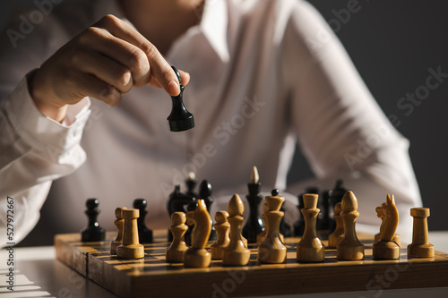 Fotobehang Faceless caucasian woman in white shirt playing chess.