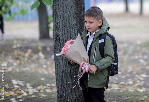 a boy with a bouquet of flowers
