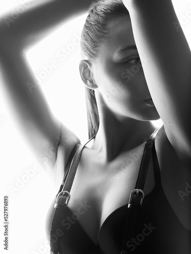 Black and white portrait. Beautiful woman in leather accessories and underwear © eugenepartyzan