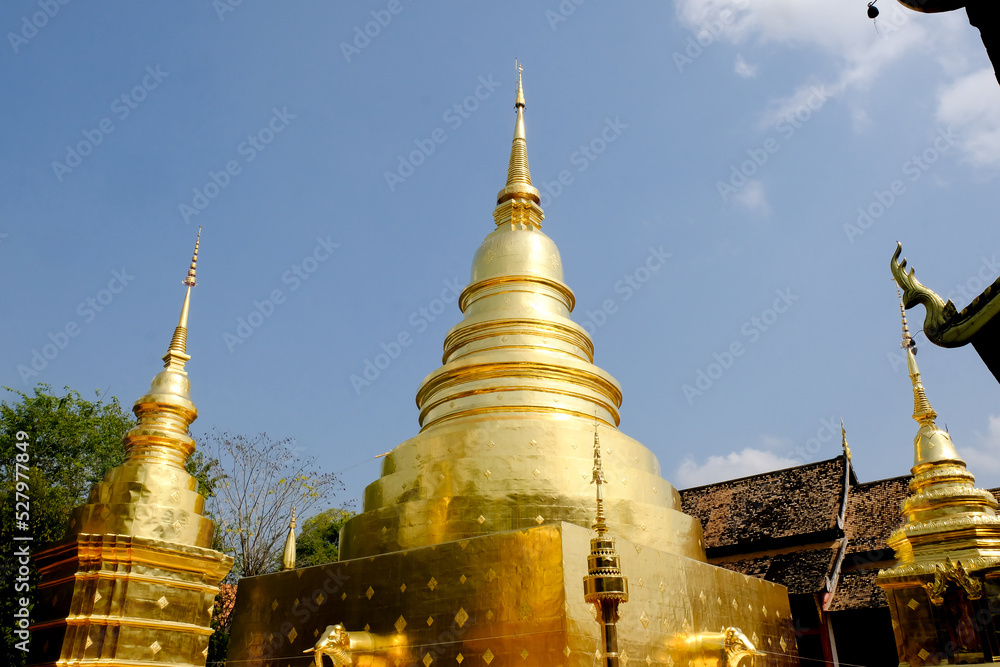 Naklejka premium The gold pagoda in Wat Phra Sing Waramahavihan temple. Phrae province, Thailand.