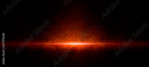 Fotografia The texture of fire on a black background is reflected, in an empty dark scene,