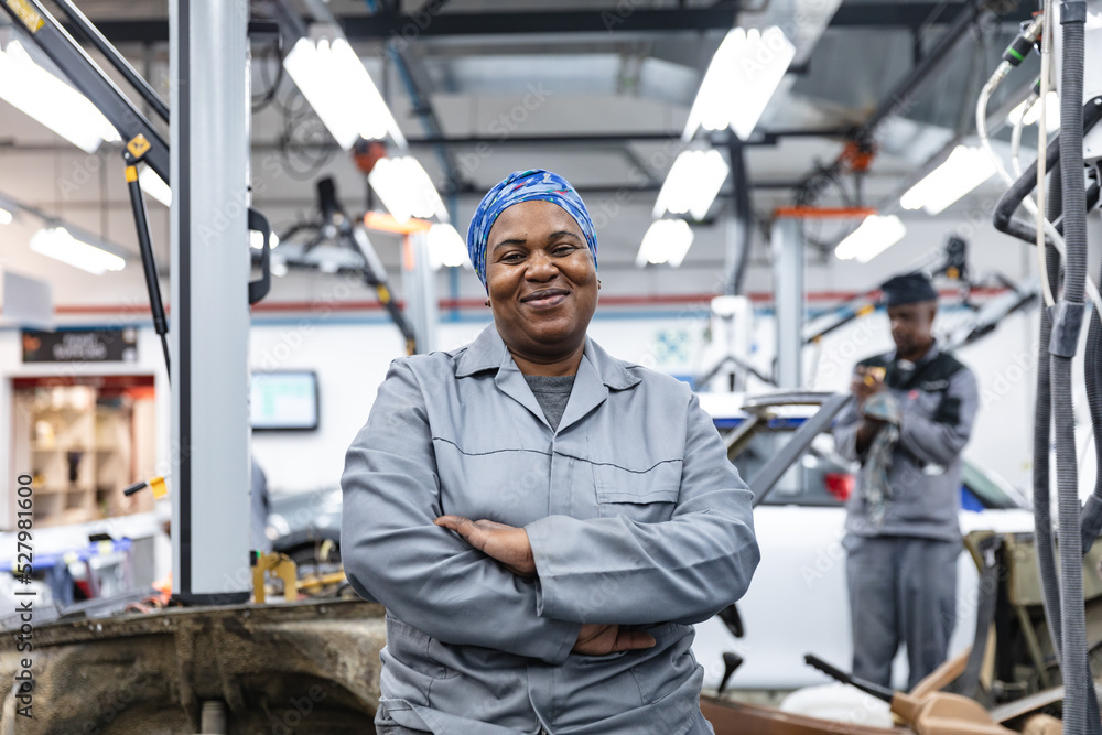 Portrait of happy African American mechanic woman Portrait of happy African American mechanic woman