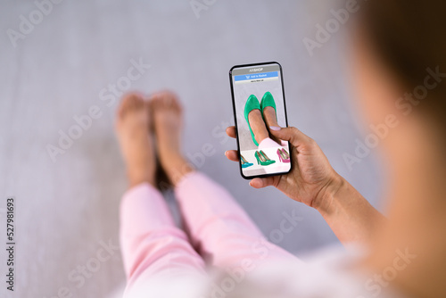 Woman Trying Virtual High Heel Shoes In Shop