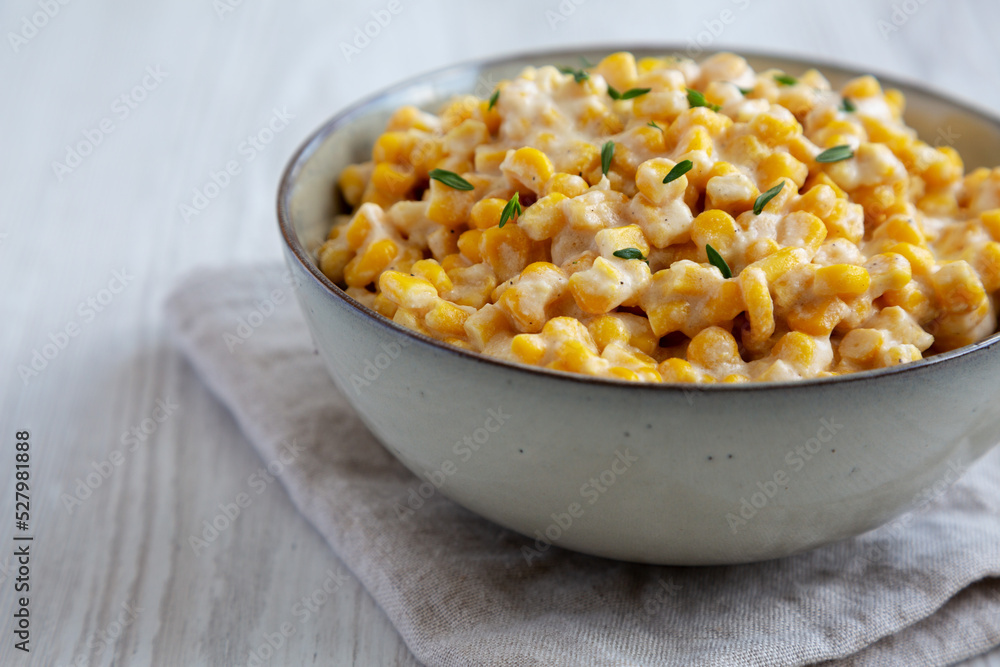 Homemade Slow Cooker Creamed Corn in a Bowl, low angle view. Homemade Slow Cooker Creamed Corn in a Bowl, low angle view.