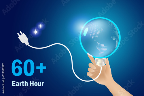 Energy crisis, earth hour concept. Hand unplug globe lightbulb to save energy. World environment day, earth day, sustainable environment.