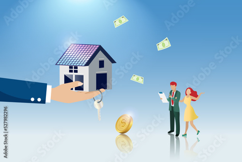 Home loan, real estate, mortgage property approval and refinance concept. Hand holding house and key to family couple. Family home buying and home investment.