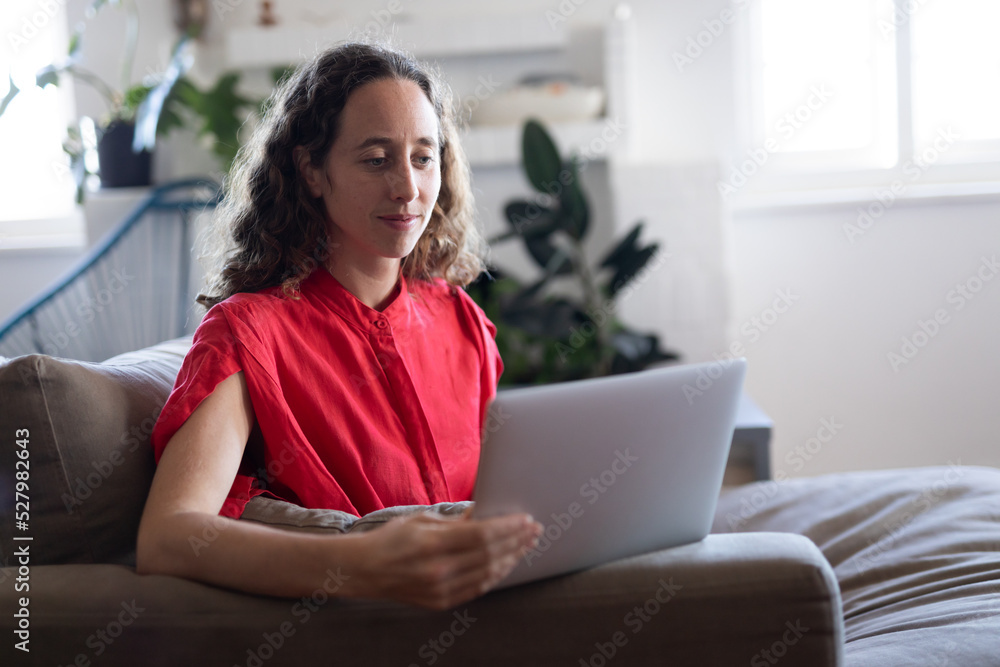 Caucasian woman using her laptop and self isolating at home during coronavirus Covid19 pandemic Caucasian woman using her laptop and self isolating at home during coronavirus Covid19 pandemic