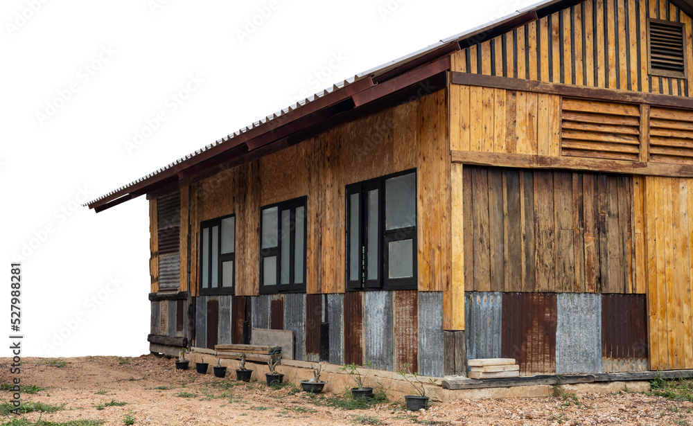 Isolate, close-up view of the front and side of an old wooden house renovated into a classic modern contemporary style, located on a mound of land, common in rural Thailand. Isolate, close-up view of the front and side of an old wooden house renovated into a classic modern contemporary style, located on a mound of land, common in rural Thailand.