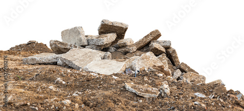 Low View Isolate Debris of large concrete blocks are piled up on the mounds of road demolition for renovations, which are common during the summer in rural Thailand.