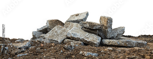 Low View Isolate Debris of large concrete blocks are piled up on the mounds of road demolition for renovations, which are common during the summer in rural Thailand.